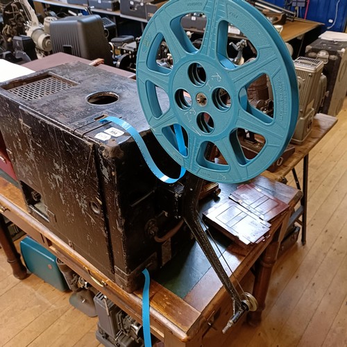 554 - A portable cinematic projector, in a painted wooden case   Provenance:  From a vast single owner col... 