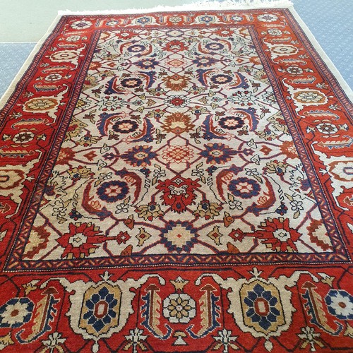 1739 - An Azerbaijan cream ground rug, 147 x 102 cm