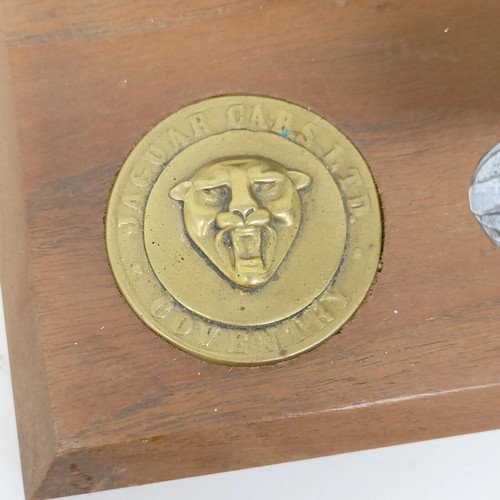 1219 - A pair of Jaguar chrome leaping cat mascots, mounted on a wooden plaque, applied a Jaguar Cars Ltd, ... 