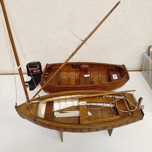 1518 - A wooden model of a clinker built boat, 50 cm wide, and another, 50 cm wide (2)