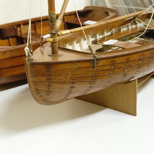 1518 - A wooden model of a clinker built boat, 50 cm wide, and another, 50 cm wide (2)