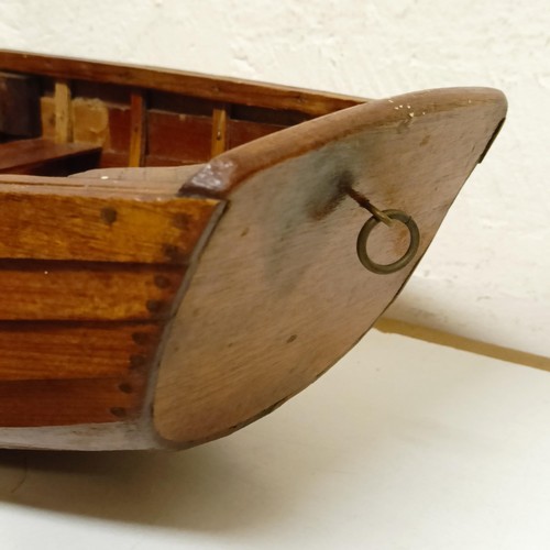 1518 - A wooden model of a clinker built boat, 50 cm wide, and another, 50 cm wide (2)