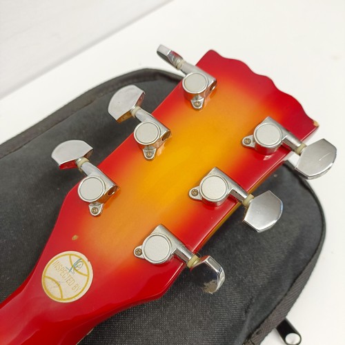 484 - A Vintage brand electric guitar, in a soft carry case