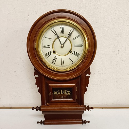 1554 - A mantel clock, in a slate case, 45 cm wide, and a wall clock in a mahogany case (2)