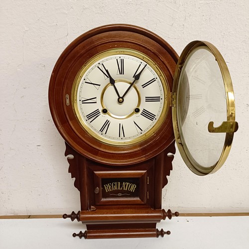 1554 - A mantel clock, in a slate case, 45 cm wide, and a wall clock in a mahogany case (2)