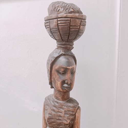 1564 - An African carving of a woman, 120 cm high 
Provenance:  Sold on behalf of SNCB Society