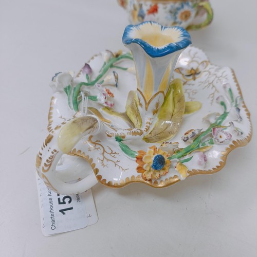 1571 - A Coalport basket decorated flowers, 20 cm wide, a cup and cover, and a chamber stick (3)