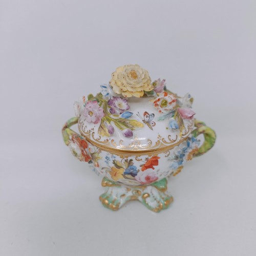 1571 - A Coalport basket decorated flowers, 20 cm wide, a cup and cover, and a chamber stick (3)