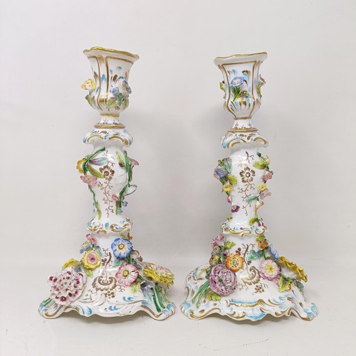 1575 - A pair of Coalport candlesticks, decorated flowers, 25 cm high (2)