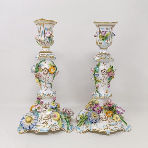 1575 - A pair of Coalport candlesticks, decorated flowers, 25 cm high (2)