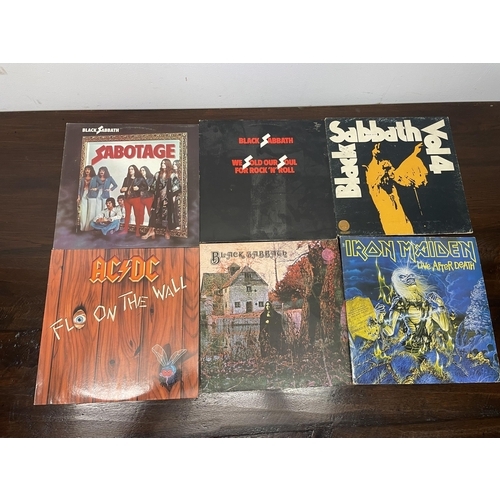 439A - Assorted vinyl LP records, to include Black Sabbath, Iron Maiden, AC-DC, and Alice Cooper, and assor... 