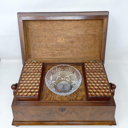 1595 - A 19th century walnut tea caddy, the hinge top to reveal marquetry inlaid caddies, and a later cut g... 