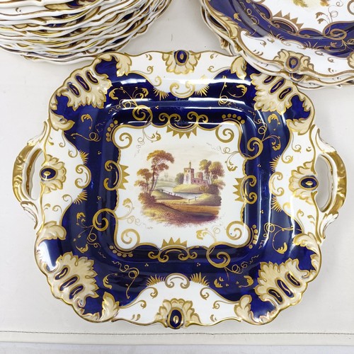 1594 - A 19th century service, with a blue border, centre decorated landscapes, comprising two tureens and ... 