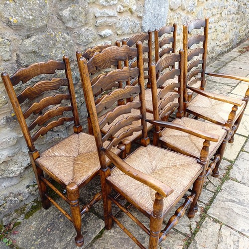 1631 - A set of eight Titchmarsh & Goodwin style oak ladder back dining chairs, with reeded seats (6+2)