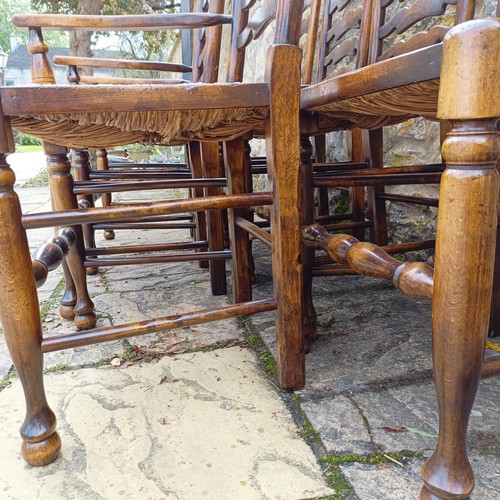 1631 - A set of eight Titchmarsh & Goodwin style oak ladder back dining chairs, with reeded seats (6+2)