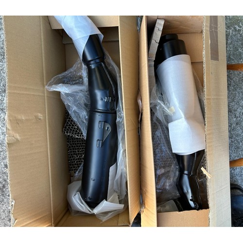 28 - A pair of Honda new old stock silencers, and other Honda new old stock parts...