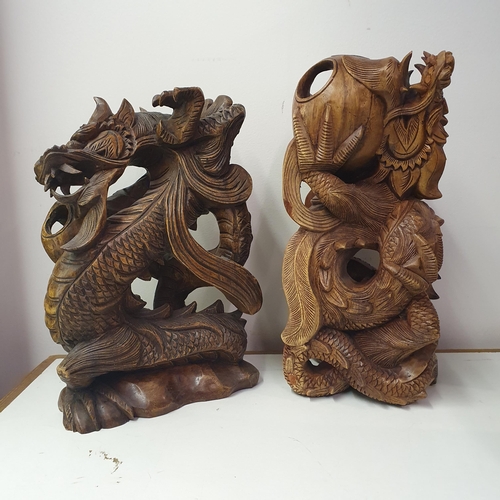 35 - A Chinese carving of a dragon, 48 cm high, and another, 32 cm high (2)