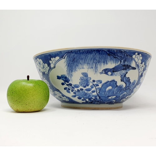 62 - A Chinese blue and white bowl, decorated birds, 30 cm diameter