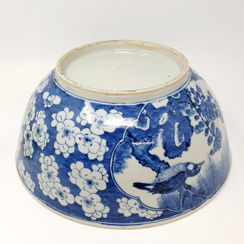 62 - A Chinese blue and white bowl, decorated birds, 30 cm diameter