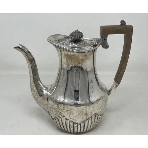 1074 - A Victorian silver coffee pot, with a wooden handle, London 1892, all in 15.2 ozt