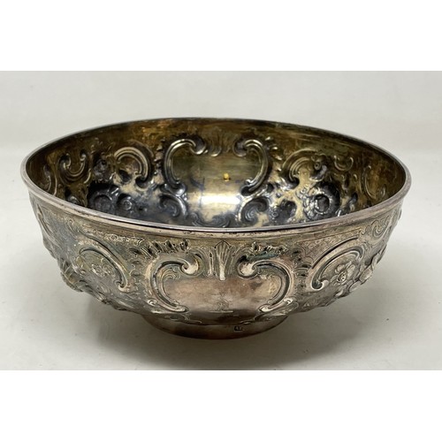 1075 - A Victorian silver bowl, with embossed decoration, marks rubbed, 11.3 ozt,