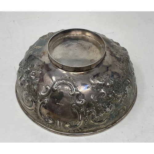 1075 - A Victorian silver bowl, with embossed decoration, marks rubbed, 11.3 ozt,