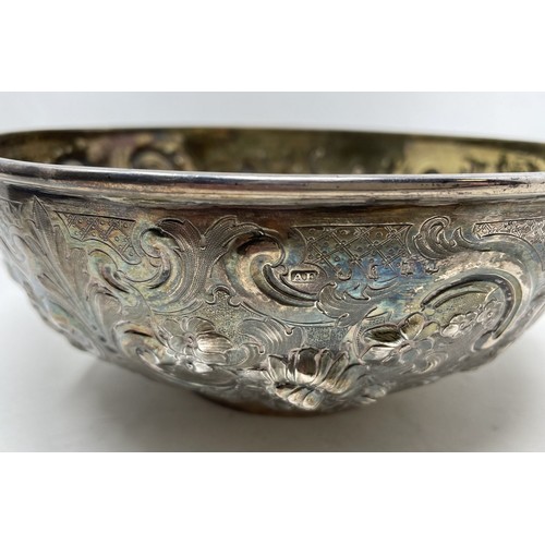 1075 - A Victorian silver bowl, with embossed decoration, marks rubbed, 11.3 ozt,