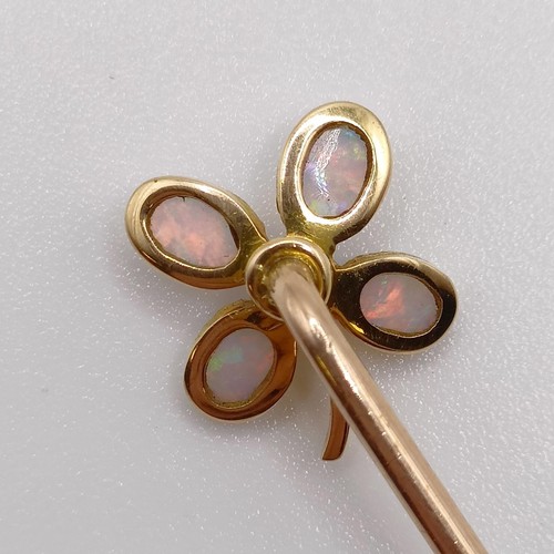 604 - An early 20th century yellow metal, diamond and opal stick pin, in the form of a flower  Provenance:... 