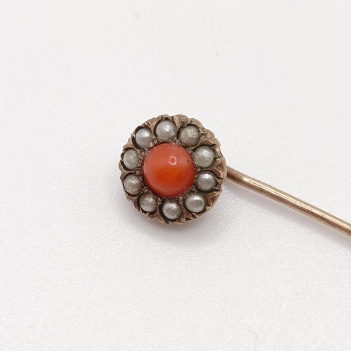 600 - A late 19th/early 20th century yellow metal, coral and seed pearl stick pin Provenance:  From a sing... 