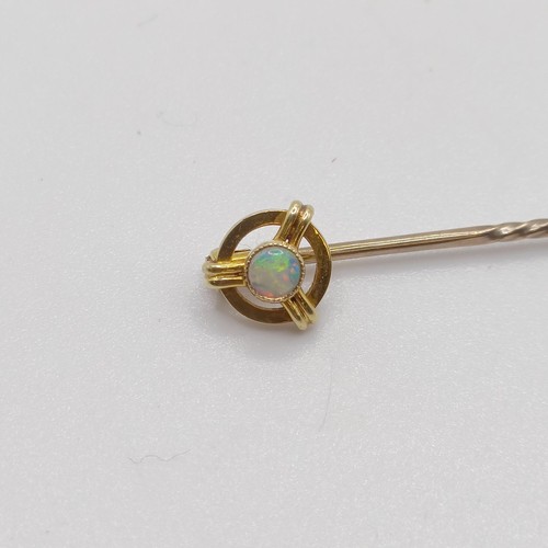 598 - A 20th century yellow coloured metal and opal stick pin  Provenance:  From a single owner collection... 