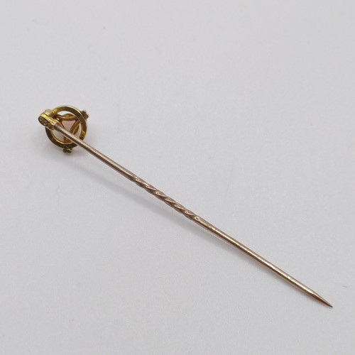 598 - A 20th century yellow coloured metal and opal stick pin  Provenance:  From a single owner collection... 