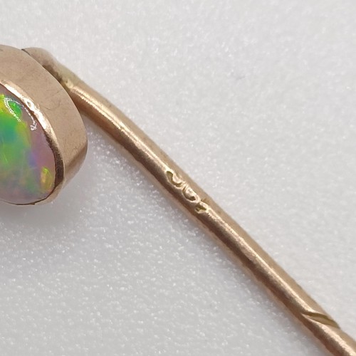 593 - A 20th century yellow coloured metal and opal stick pin  Provenance:  From a single owner collection... 