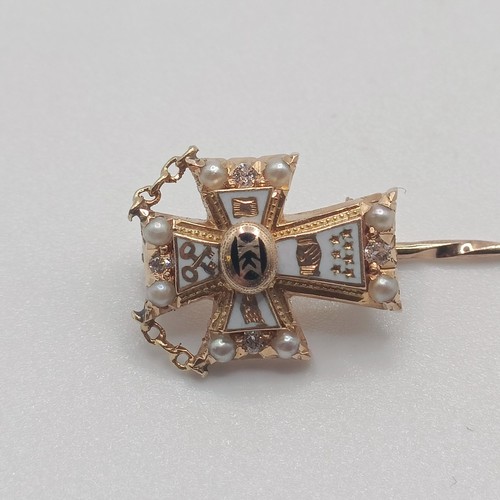 590 - An early 20th century white enamel, seed pearl and diamond stick pin, with the back engaved  Provena... 