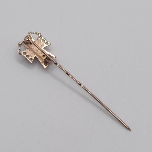 590 - An early 20th century white enamel, seed pearl and diamond stick pin, with the back engaved  Provena... 