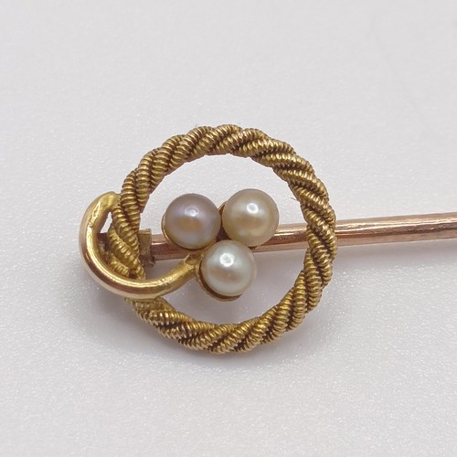 587 - A late 19th/early 20th century yellow metal and seed pearl stick pin  Provenance:  From a single own... 