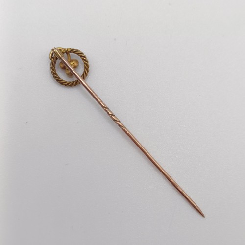 587 - A late 19th/early 20th century yellow metal and seed pearl stick pin  Provenance:  From a single own... 