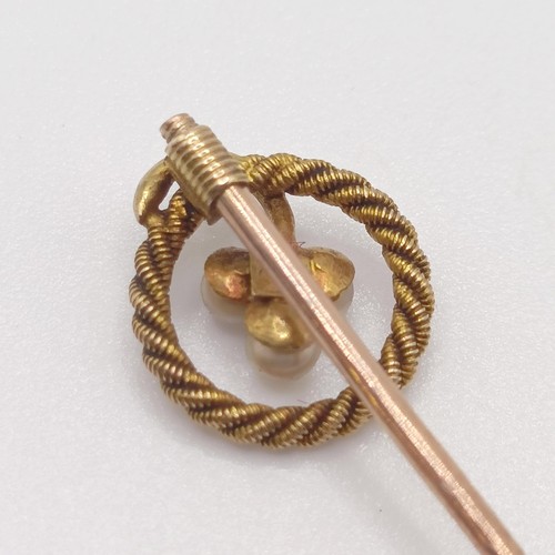 587 - A late 19th/early 20th century yellow metal and seed pearl stick pin  Provenance:  From a single own... 