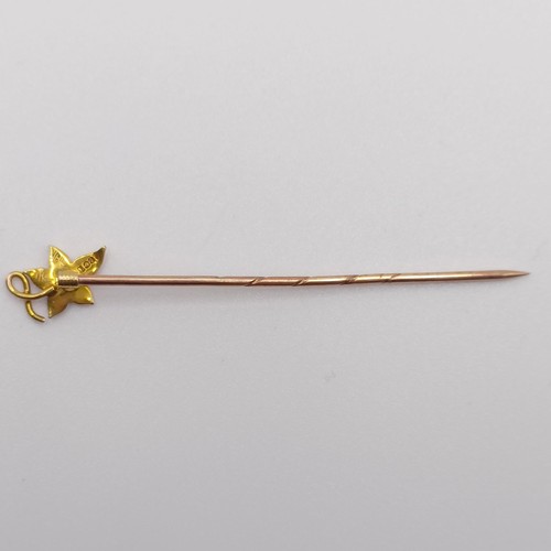 586 - A late 19th/early 20th century yellow metal and seed pearl stick pin, in the form of a leaf Provenan... 