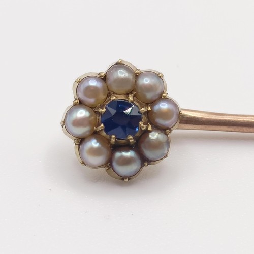 585 - A late 19th/early 20th century yellow metal, sapphire and seed pearl stick pin  Provenance:  From a ... 