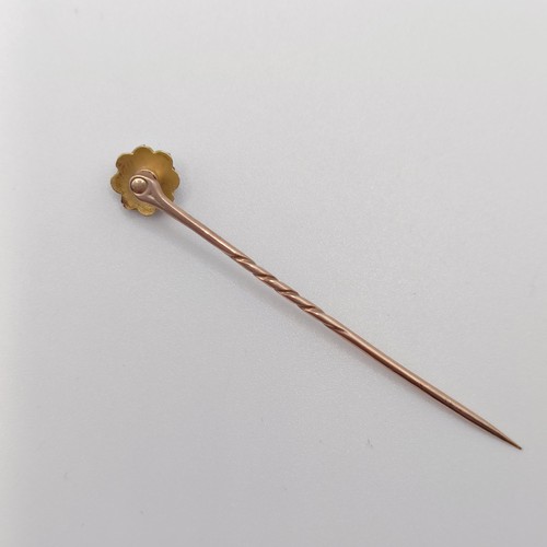 585 - A late 19th/early 20th century yellow metal, sapphire and seed pearl stick pin  Provenance:  From a ... 