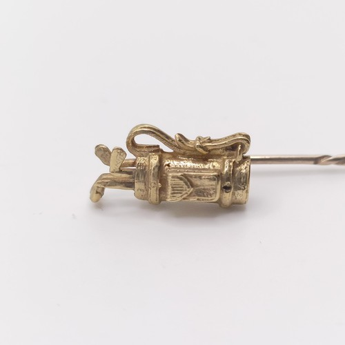 584 - A 20th century yellow metal stick pin, in the form of a set of golf clubs Provenance:  From a single... 