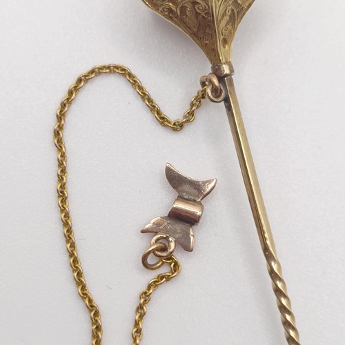 583 - A 19th century yellow metal and black enamel stick pin, in the form of a scepter   Provenance:  From... 