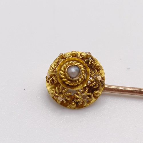 581 - A late 19th/early 20th century yellow metal and seed pearl stick pin  Provenance:  From a single own... 