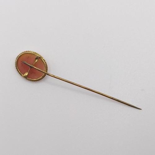 580 - A late 19th/early 20th century yellow metal stick pin, inset with a cameo, decorated lady  Provenanc... 