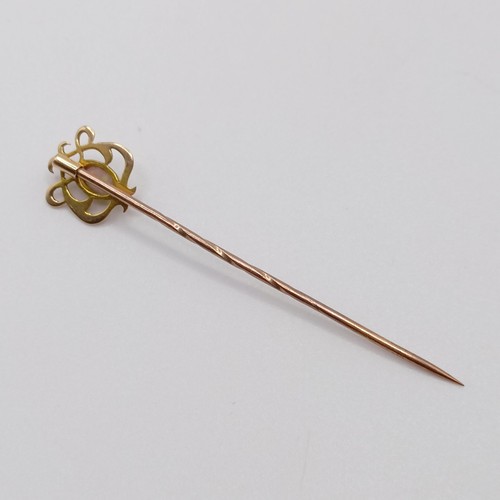 577 - An Art Nouveau style yellow metal and opal stick pin  Provenance:  From a single owner collection of... 