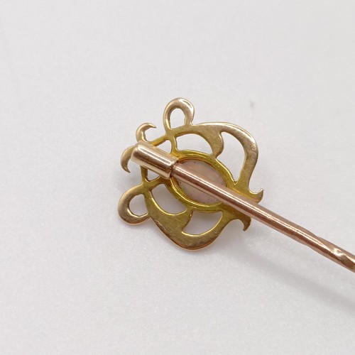 577 - An Art Nouveau style yellow metal and opal stick pin  Provenance:  From a single owner collection of... 