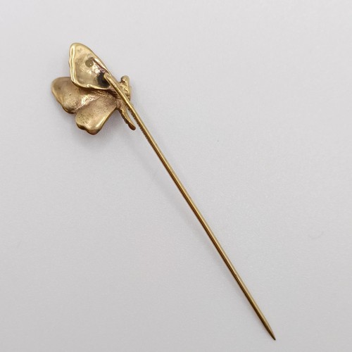 575 - An early 20th century yellow metal stick pin, in the form of a butterfly  Provenance:  From a single... 