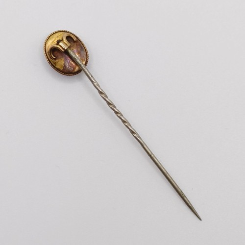 573 - A late 19th/early 20th century yellow metal and hardstone stick pin  Provenance:  From a single owne... 