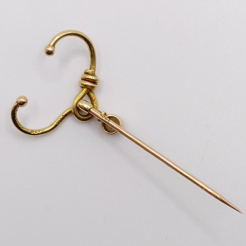 572 - A late 19th/early 20th century yellow metal and pearl stick pin, in the form of a noose  Provenance:... 