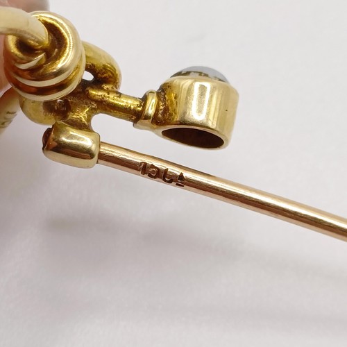 572 - A late 19th/early 20th century yellow metal and pearl stick pin, in the form of a noose  Provenance:... 